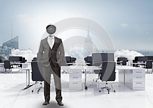 Businessman with CCTV head in office above city skyline