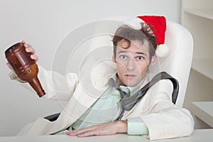 Businessman celebrating Christmas at office