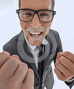 Businessman celebrating with his fists raised in the air