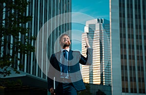 Businessman celebrating his success in a business center.