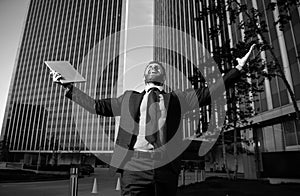 Businessman celebrating his success in a business center.