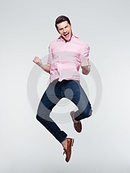 Businessman celebrating his success and jumping