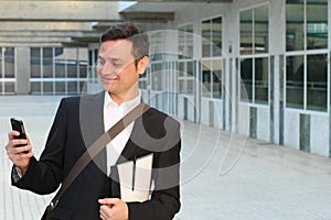 Businessman celebrating his success on smartphone - Stock image with copy space