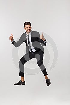 Businessman celebrating success Full Length Portrait isolated on White Background.