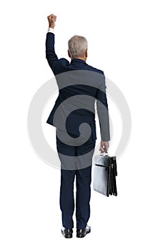 Businessman celebrating success and holding a briefcase