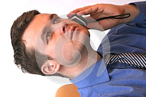 Businessman on cellular phone - active listener photo