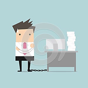 Businessman chained to the desk