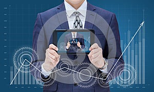 Businessman on chart background growth demonstrates on the mobile device itself. photo