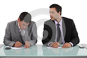 Businessman cheating in exam