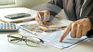 Businessman checking accounts and business income, the concept of financial management.