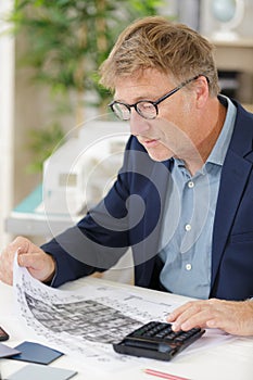 businessman checking business data and bars