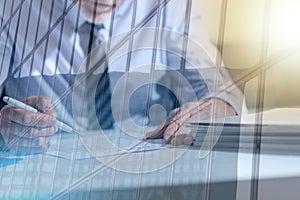 Businessman checking a document, light effect, double exposure