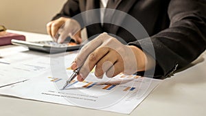 Businessman checking financial reports at work concept of office work