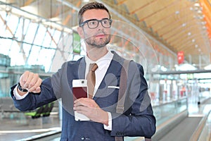 Businessman checking the time in the airport