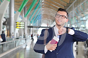 Businessman checking the time in the airport