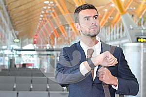 Businessman checking the time in the airport