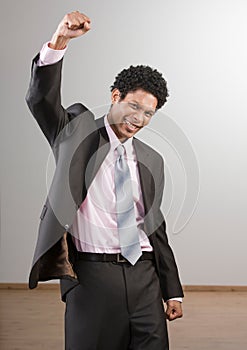 Businessman cheering and celebrating his success