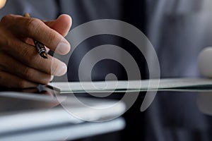 Businessman sign cheque