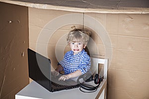 Businessman child is in trouble with the computer, curve face