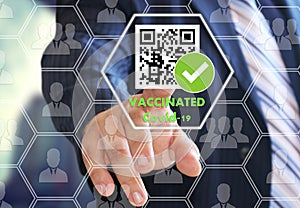 The businessman chooses the International certificate of vaccination from coronavirus on the touch screen. QR code vaccinated from