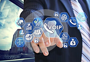 The businessman chooses VOIP on the virtual screen in social net