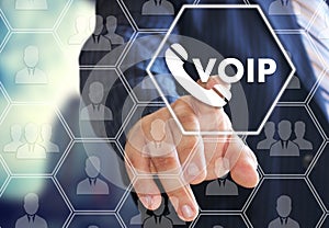 The businessman chooses VOIP on the virtual screen in social network connection