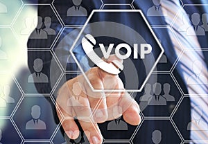 The businessman chooses VOIP on the virtual screen in social network connection