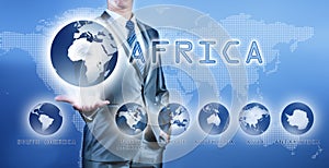 Businessman choosing africa continent on virtual digital screen