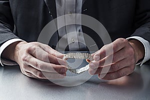 Businessman choosing jewelry for his wife