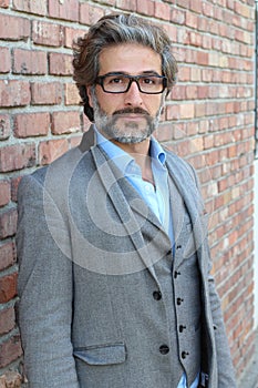 Businessman in classic suit and vest wearing glasses