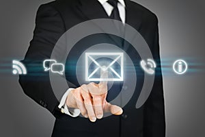 Businessman clicking on email icon