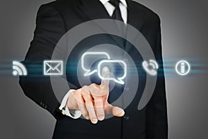 Businessman clicking on live chat icon