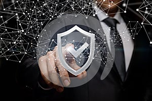 Businessman clicks on the shield to protect .