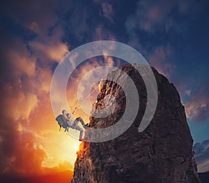 Businessman climb a mountain to get the flag. Achievement business goal and difficult career concept