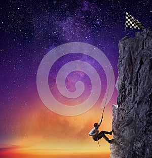 Businessman climb a mountain to get the flag. Achievement business goal and difficult career concept