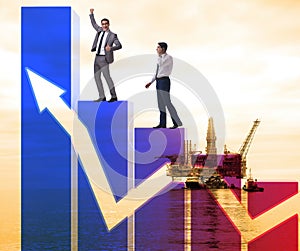 Businessman climbing bar charts in growth concept