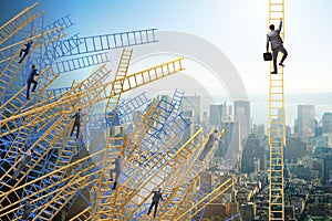 The businessman climbing career ladder in business concept