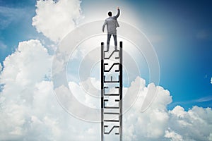 The businessman climbing the career ladder of success
