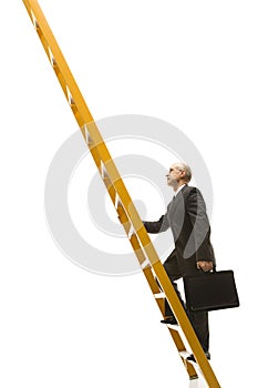 Businessman climbing ladder.