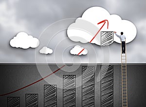 Businessman climbing ladder drawing growth chart on cloud