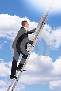 Businessman climbing a ladder in the sky