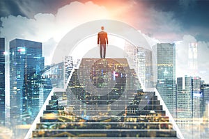 Businessman climbing stairs, night city