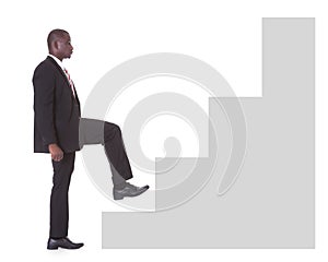 Businessman climbing steps