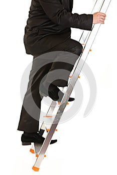 Businessman climbing upwards upon ladder. Close-up