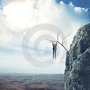 Businessman climbs a mountain photo