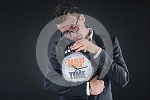 The businessman with clock sleeping in business concept