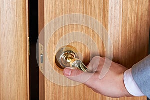 Businessman closing wooden door