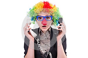 Businessman with clown wig isolated on the white