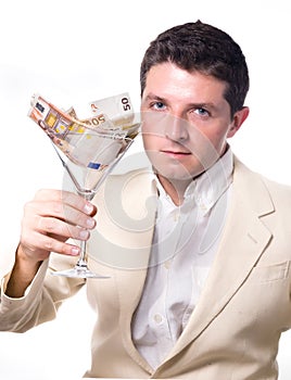 Businessman with Cocktail Glass full of Banknotes