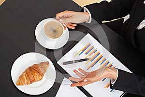 Businessman with coffee during explanation